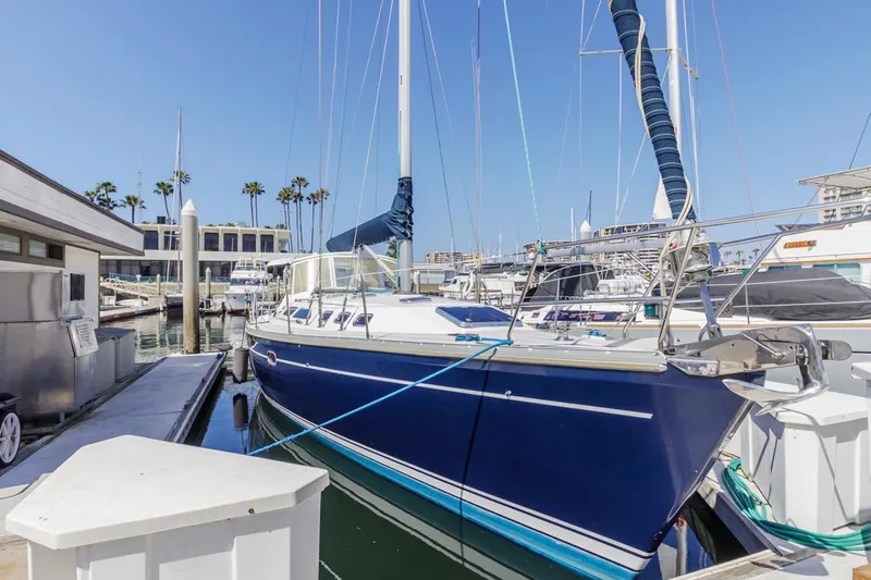 Blue Moon Yacht Photos Pics 2004 Catalina 400 MkII sailboat docked at marina under clear blue sky.