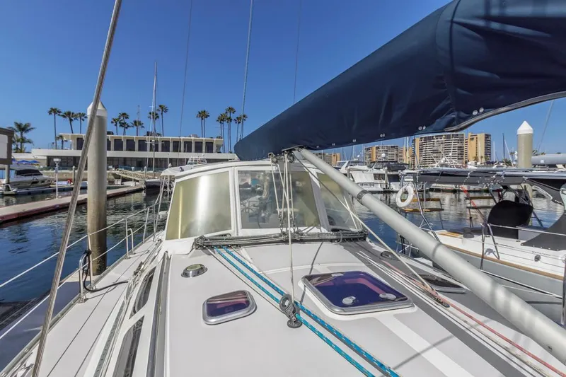Blue Moon Yacht Photos Pics 2004 Catalina 400 MkII sailboat docked at marina with clear blue sky.