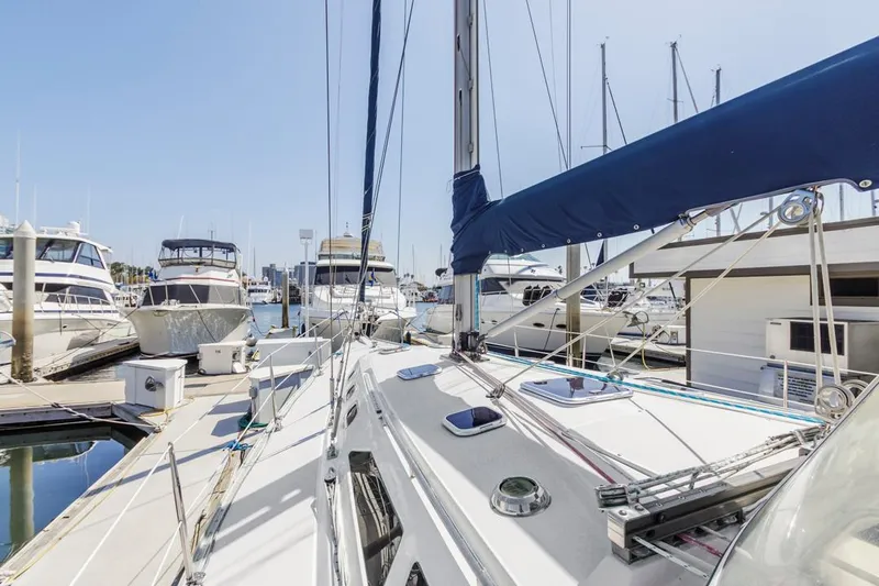 Blue Moon Yacht Photos Pics Sailboat docked in marina, Catalina 400 MkII, 2004 model, surrounded by other boats.