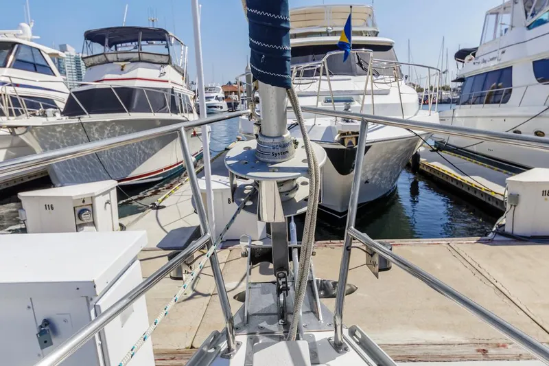 Blue Moon Yacht Photos Pics Bow view of a 2004 Catalina 400 MkII sailboat docked in a marina.