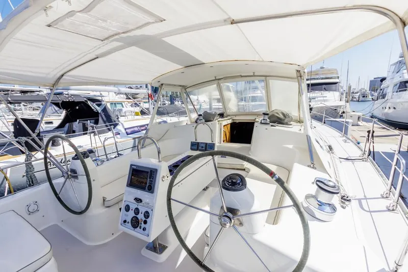 Blue Moon Yacht Photos Pics 2004 Catalina 400 MkII sailboat cockpit with dual steering wheels, docked at a marina.
