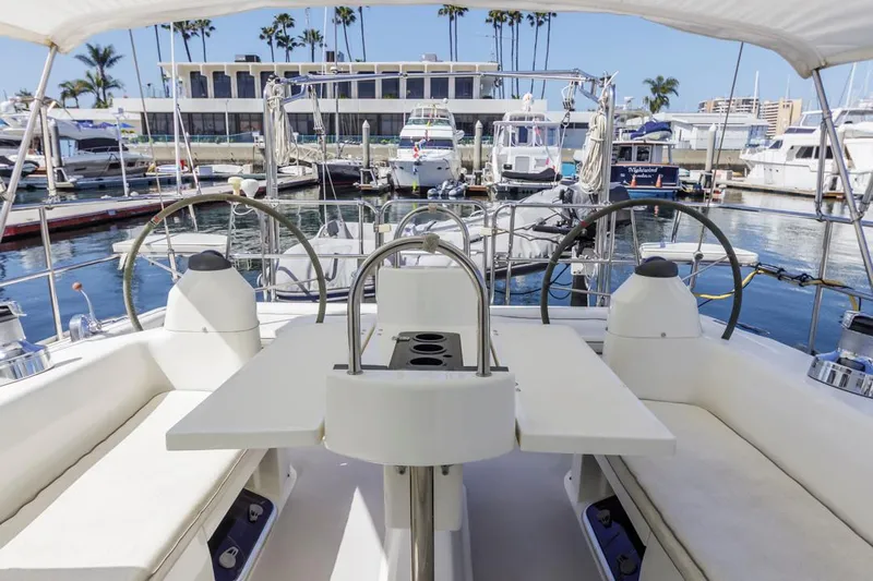 Blue Moon Yacht Photos Pics Cockpit view of 2004 Catalina 400 MkII sailboat docked at marina with palm trees.