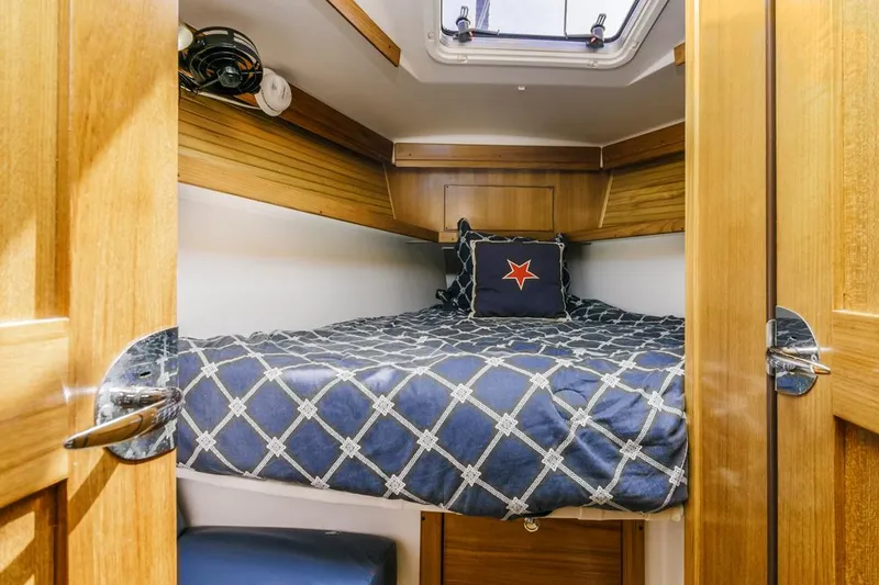 Blue Moon Yacht Photos Pics Cozy cabin interior of 2004 Catalina 400 MkII sailboat with nautical bedding.