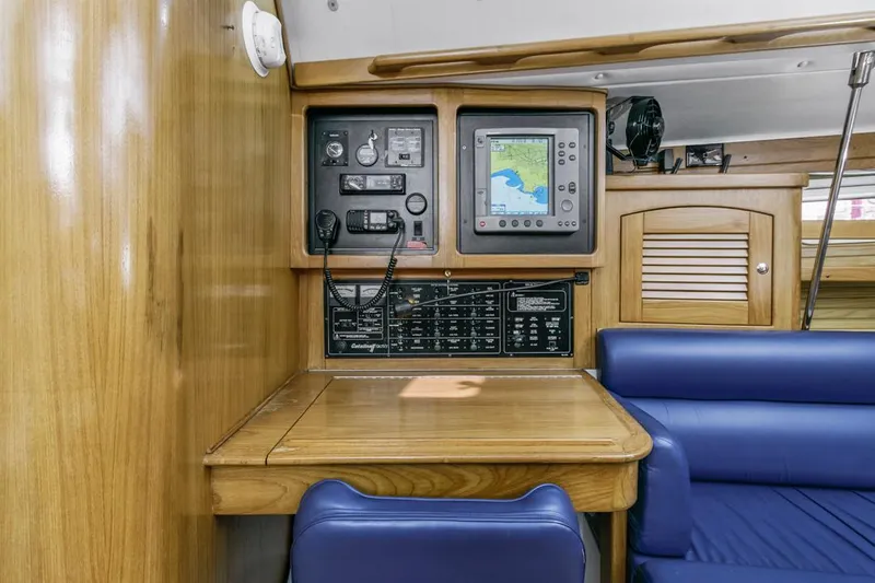 Blue Moon Yacht Photos Pics Navigation station in 2004 Catalina 400 MkII yacht with control panel and seating.