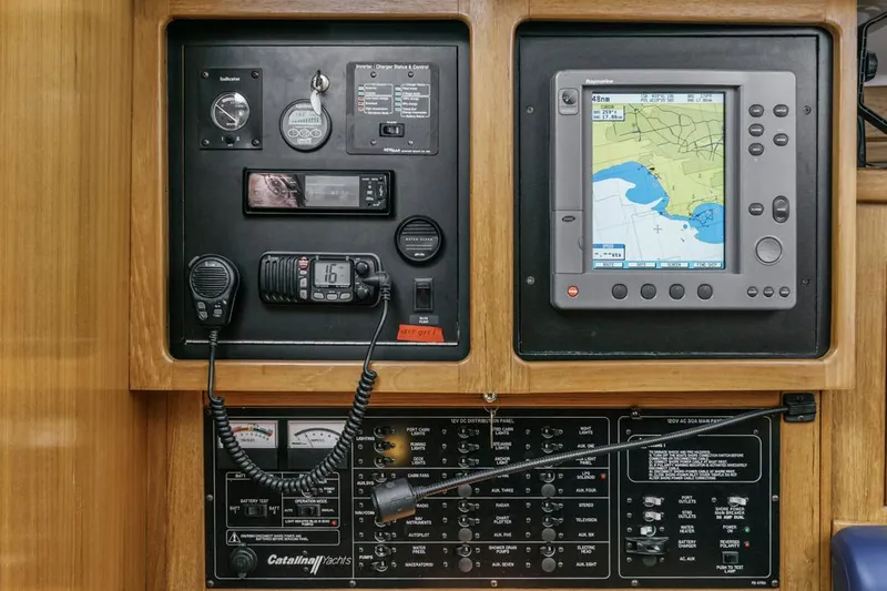 Blue Moon Yacht Photos Pics Control panel of a 2004 Catalina 400 MkII sailboat with navigation and communication equipment.