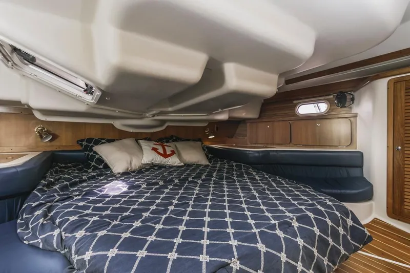 Blue Moon Yacht Photos Pics Luxurious cabin interior of 2004 Catalina 400 MkII sailboat with cozy bedding.