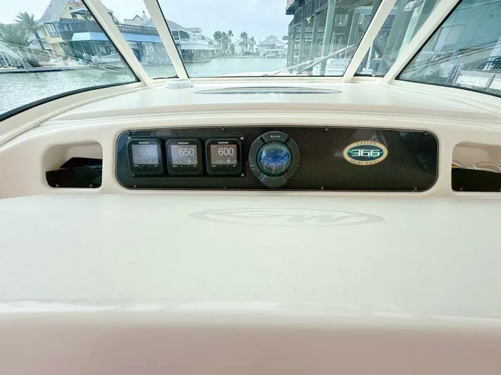  Yacht Photos Pics Grady-White 366 Canyon 2011 dashboard with 2020 Suzuki engines, docked in a marina.
