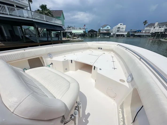  Yacht Photos Pics Grady-White 366 Canyon boat with 2020 Suzuki engines, docked in a residential waterfront area.