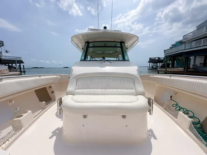  Yacht Photos Pics 2011 Grady-White 366 Canyon boat with 2020 Suzuki engines, docked by the water.