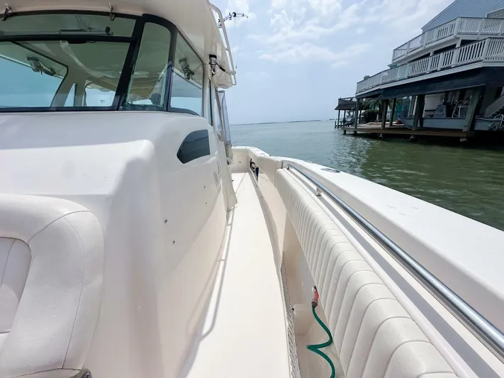  Yacht Photos Pics Grady-White 366 Canyon boat with 2020 Suzuki engines docked by waterfront homes.