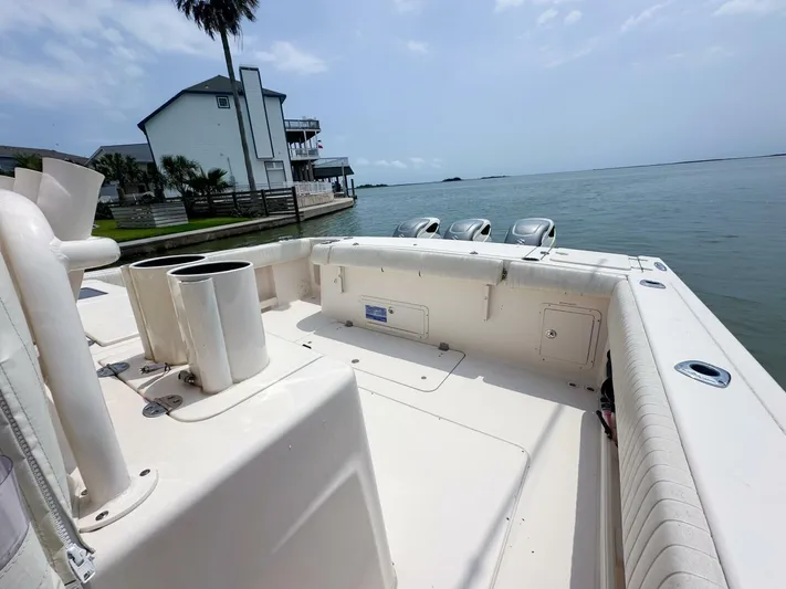  Yacht Photos Pics Grady-White 366 Canyon boat with 2020 Suzuki engines docked by waterfront home.