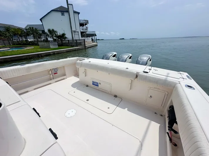  Yacht Photos Pics Grady-White 366 Canyon boat with 2020 Suzuki engines docked by waterfront homes.