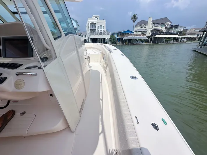  Yacht Photos Pics 2011 Grady-White 366 Canyon boat with 2020 Suzuki engines docked near waterfront homes.