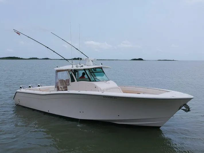  Yacht Photos Pics 2011 Grady-White 366 Canyon boat with 2020 Suzuki engines on calm water.