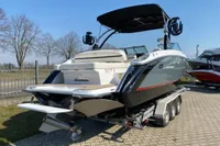 2020 Cobalt R7 Surf boat on trailer, parked outdoors on a sunny day.