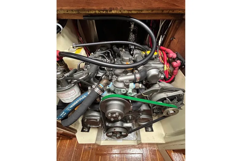 Kai Mana Yacht Photos Pics Engine compartment of a 1990 Pacific Seacraft PSC 37 sailboat, showing detailed components.