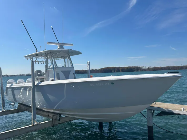  Yacht Photos Pics 2022 Contender 35 ST boat docked on a sunny day.