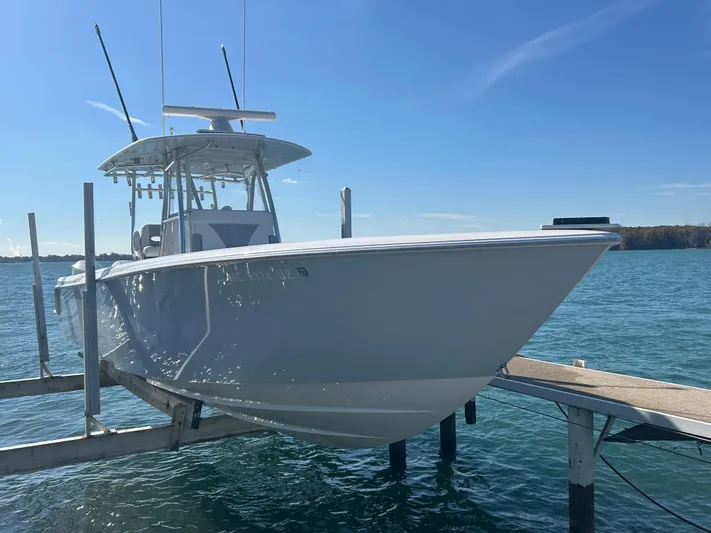  Yacht Photos Pics 2022 Contender 35 ST boat docked on a sunny day.