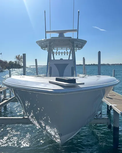  Yacht Photos Pics 2022 Contender 35 ST boat docked on a sunny day.