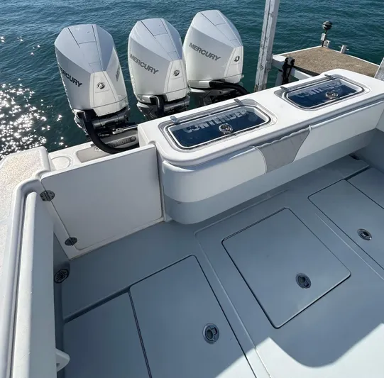  Yacht Photos Pics 2022 Contender 35 ST boat with triple Mercury engines on a sunny day.