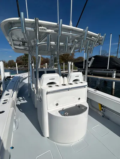  Yacht Photos Pics 2022 Contender 35 ST boat with T-top and seating, docked at marina.