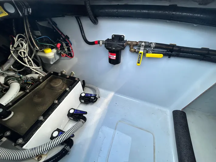  Yacht Photos Pics 2022 Contender 35 ST boat engine compartment with wiring and fuel system components.