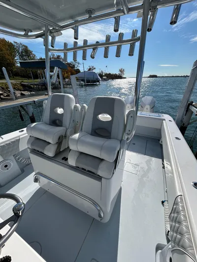  Yacht Photos Pics 2022 Contender 35 ST boat with dual seats, rod holders, and scenic waterfront view.