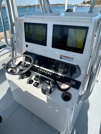  Yacht Photos Pics 2022 Contender 35 ST boat dashboard with dual navigation screens and steering wheel.
