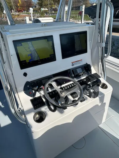  Yacht Photos Pics 2022 Contender 35 ST boat dashboard with dual screens and steering wheel.