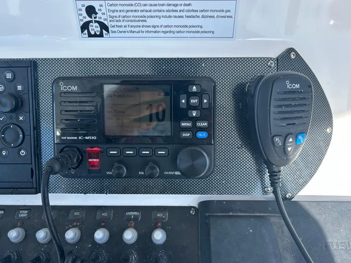  Yacht Photos Pics ICOM marine radio system on 2022 Contender 35 ST boat dashboard.