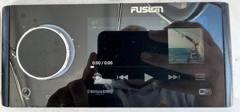  Yacht Photos Pics Fusion audio system on a 2022 Contender 35 ST boat, displaying media controls.