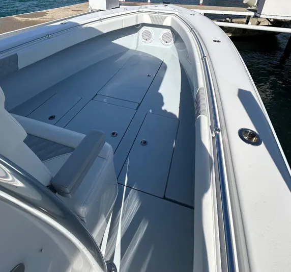  Yacht Photos Pics 2022 Contender 35 ST boat interior with seating and storage compartments.