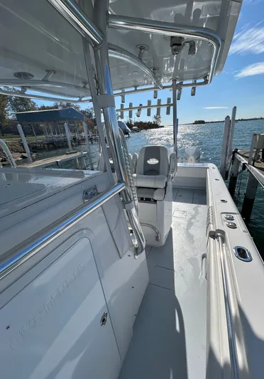  Yacht Photos Pics 2022 Contender 35 ST boat docked by the water on a sunny day.
