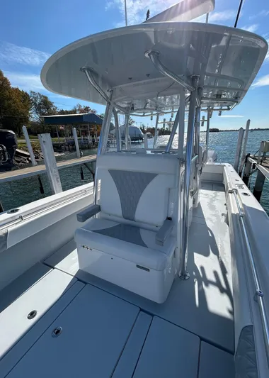  Yacht Photos Pics 2022 Contender 35 ST boat docked, featuring sleek design and spacious seating.