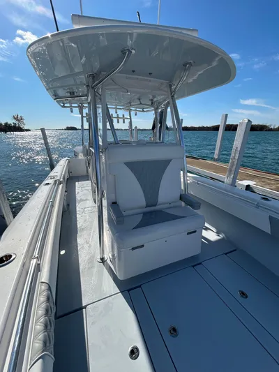  Yacht Photos Pics 2022 Contender 35 ST boat, sleek design, spacious deck, docked by the water.