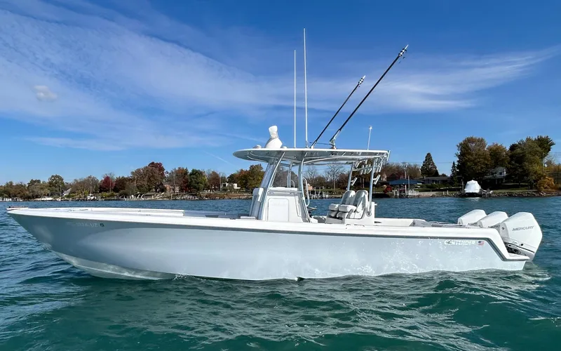 Yacht Photos Pics 2022 Contender 35 ST boat on clear water under blue sky.