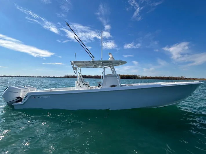  Yacht Photos Pics 2022 Contender 35 ST boat on water under clear blue sky.