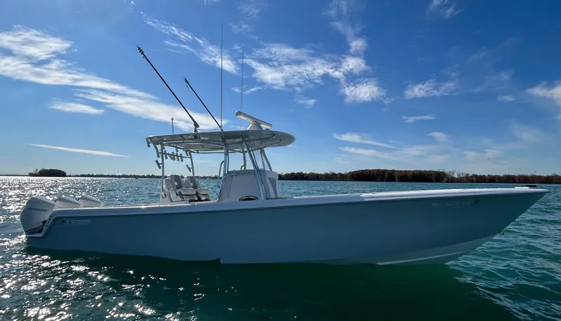  Yacht Photos Pics 2022 Contender 35 ST boat on calm water under a clear blue sky.