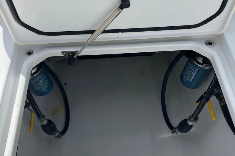  Yacht Photos Pics 2016 Contender 30 ST boat compartment with fuel filters and hoses.