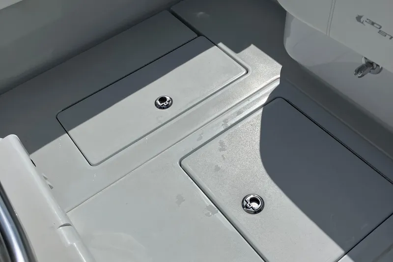  Yacht Photos Pics 2016 Contender 30 ST boat deck with storage compartments and metal latches.