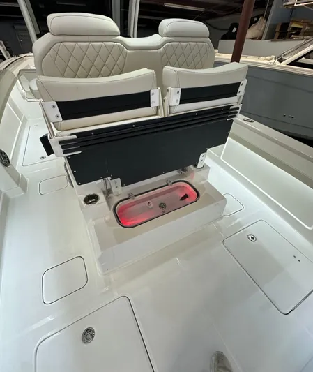 Wcn 55877 280ccx Yacht Photos Pics 2025 World Cat 280 CCX boat interior with luxurious seating and storage compartments.