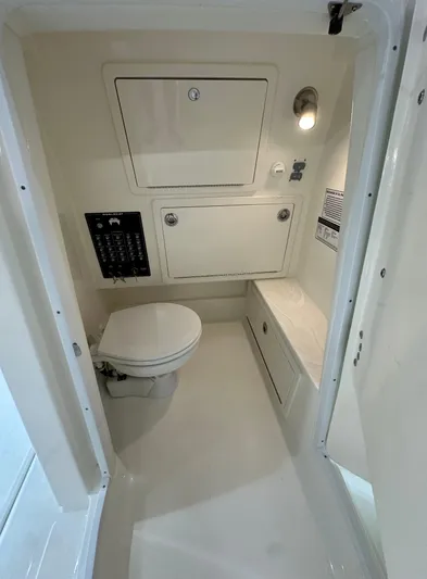 Wcn 55877 280ccx Yacht Photos Pics 2025 World Cat 280 CCX boat interior bathroom with toilet and storage compartments.