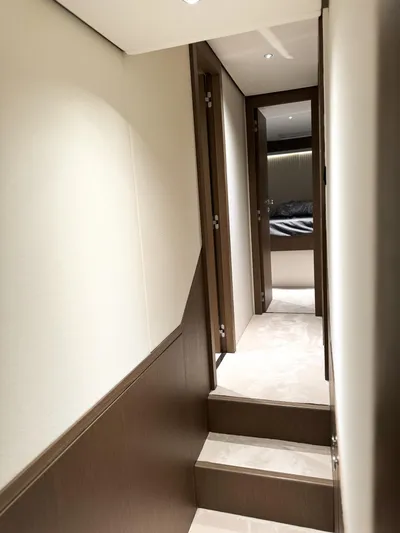  Yacht Photos Pics Interior hallway of 2023 Azimut Magellano 66 yacht, featuring modern design and elegant finishes.