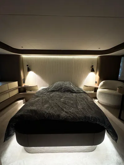  Yacht Photos Pics Luxurious bedroom interior of 2023 Azimut Magellano 66 yacht with modern lighting.