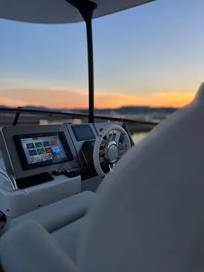  Yacht Photos Pics 2023 Azimut Magellano 66 yacht helm with sunset view.