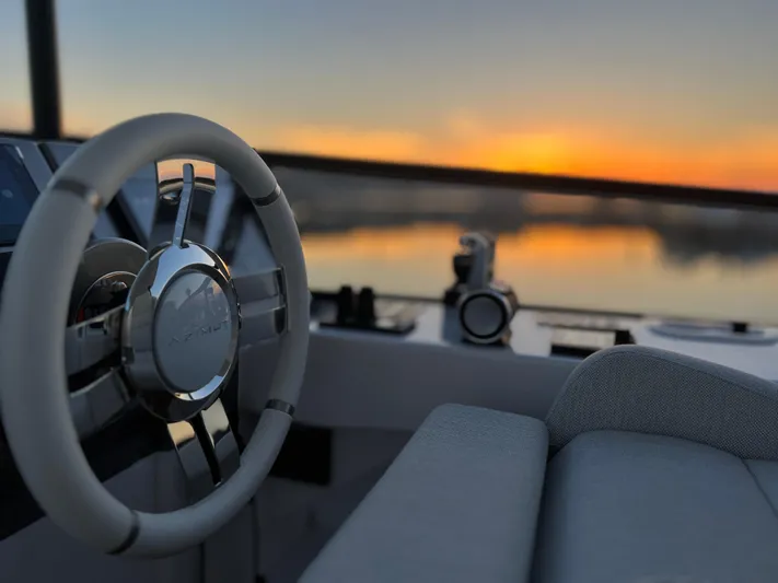  Yacht Photos Pics 2023 Azimut Magellano 66 yacht helm with sunset view.