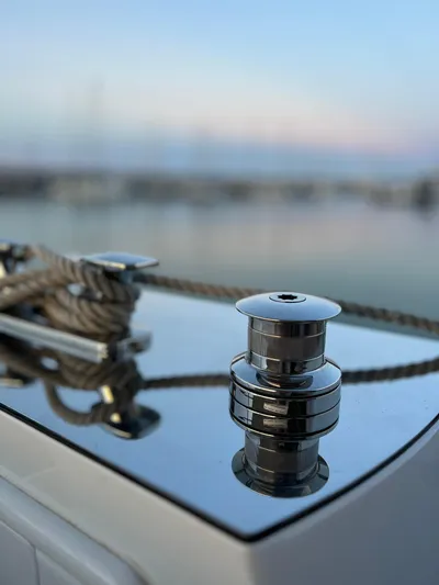  Yacht Photos Pics Close-up of 2023 Azimut Magellano 66 yacht's polished deck cleat and rope.