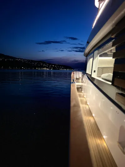  Yacht Photos Pics Azimut Magellano 66 yacht at sunset, 2023 model, serene waterscape.