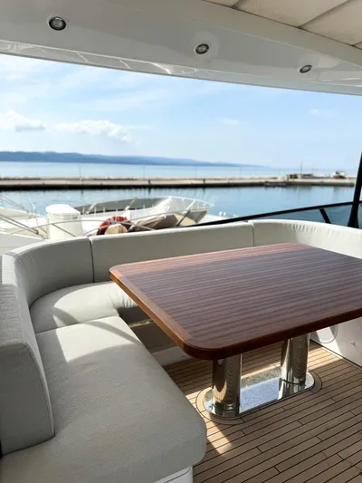  Yacht Photos Pics Luxury seating area on 2023 Azimut Magellano 66 yacht with ocean view.