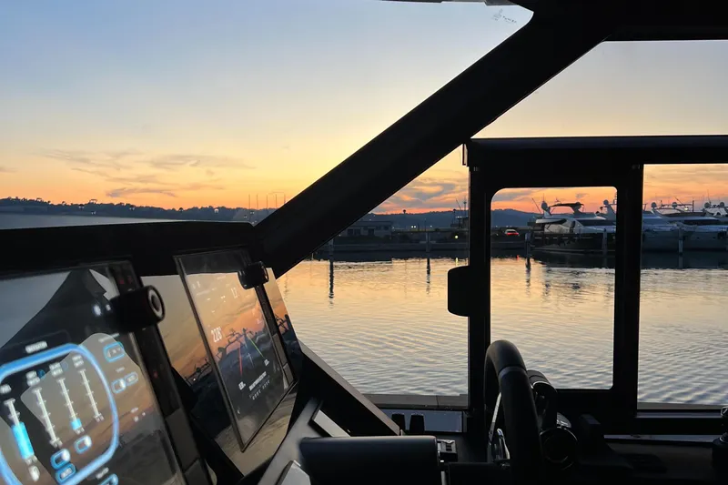  Yacht Photos Pics Cockpit view of 2023 Azimut Magellano 66 yacht at sunset in marina.